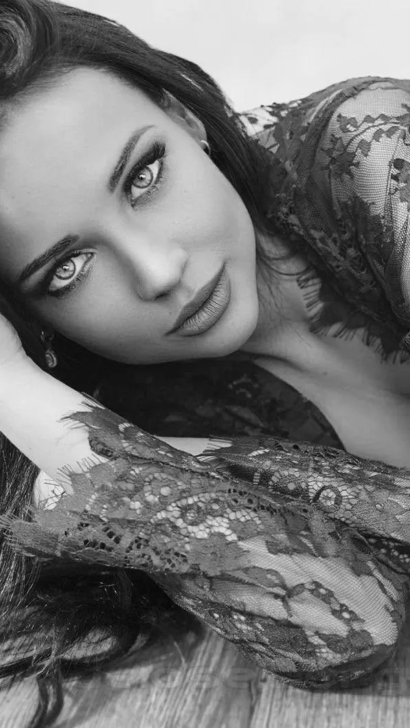 Woman in a Pink Sweatshirt Posing in Warm Golden Light Image