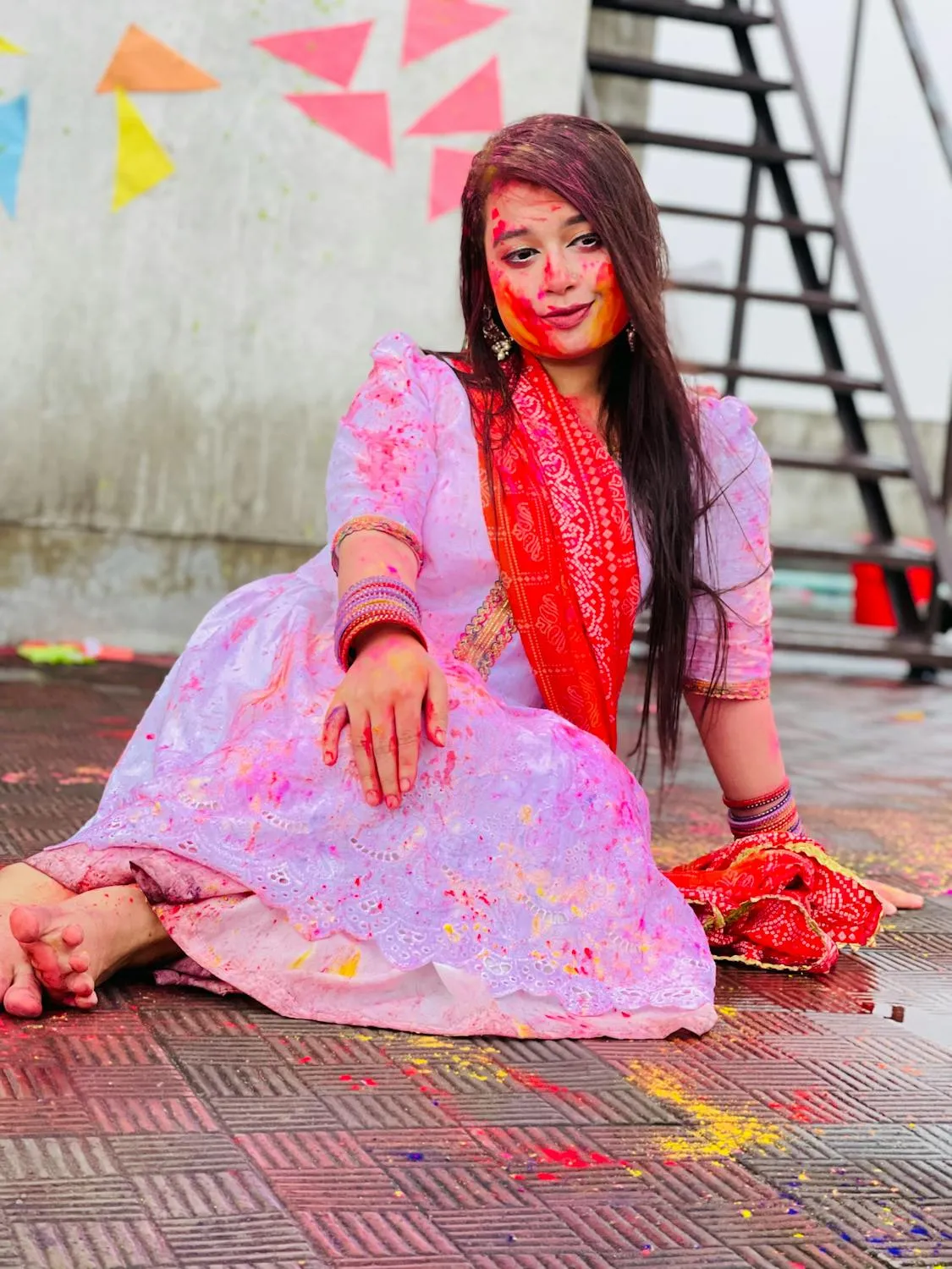 Woman in a Pink Traditional Dress Sitting on the Rooftop
