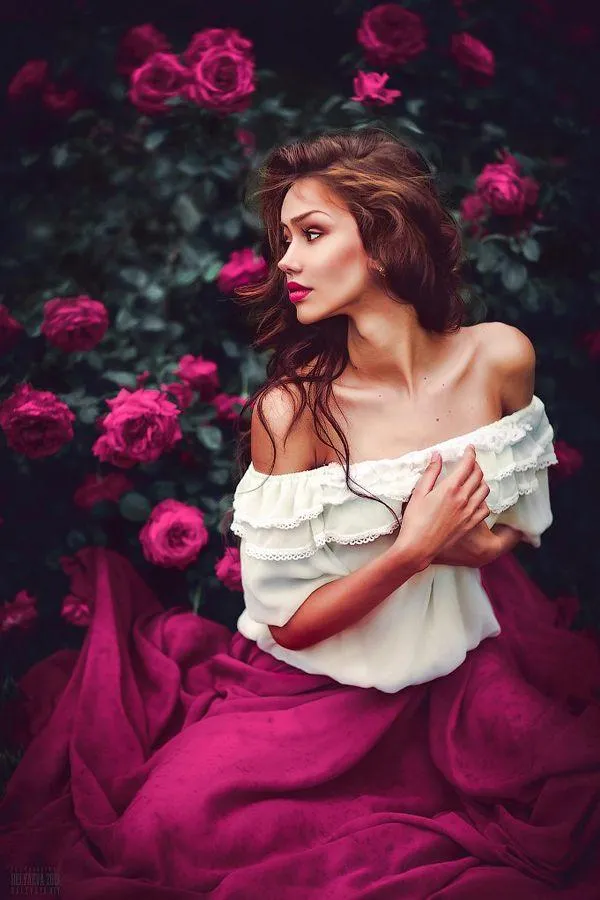 Woman Resting Chin on Her Hand with Thoughtful Soft Gaze