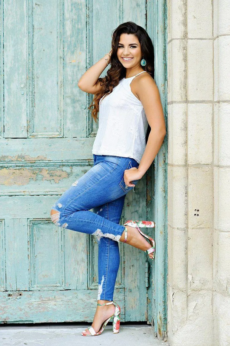 Woman Resting Her Head on a Table in a Cozy Indoor Setting
