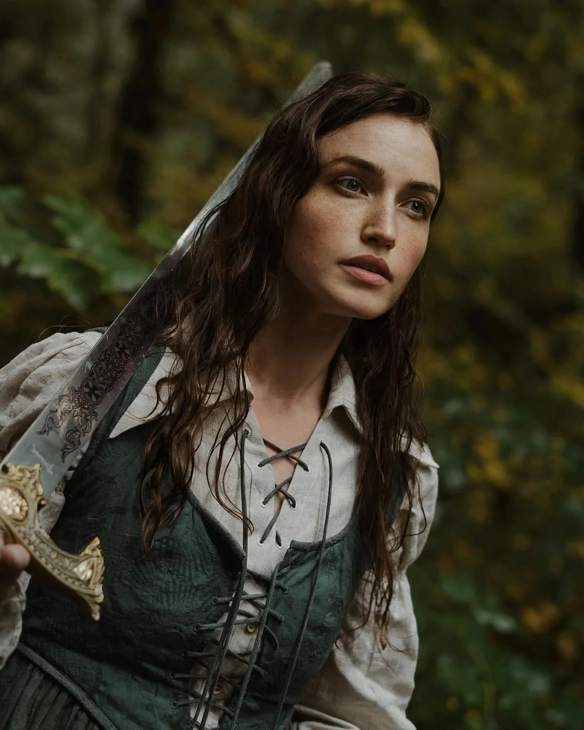 Woman in Rustic Outfit Posing Thoughtfully in Forest Setting