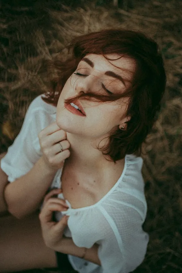 Woman with Short Hair and White Top in Outdoor Natural Light