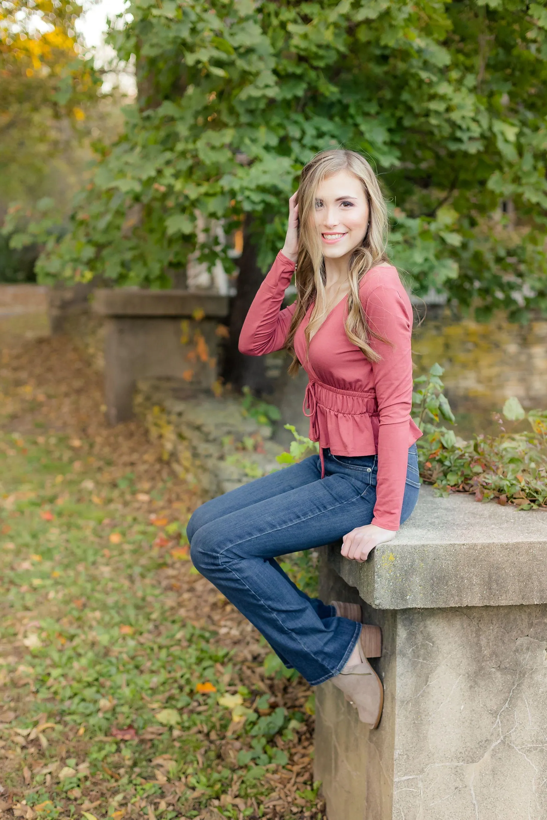 Woman Sitting Among Yellow Flowers Enjoying a Warm Day Image