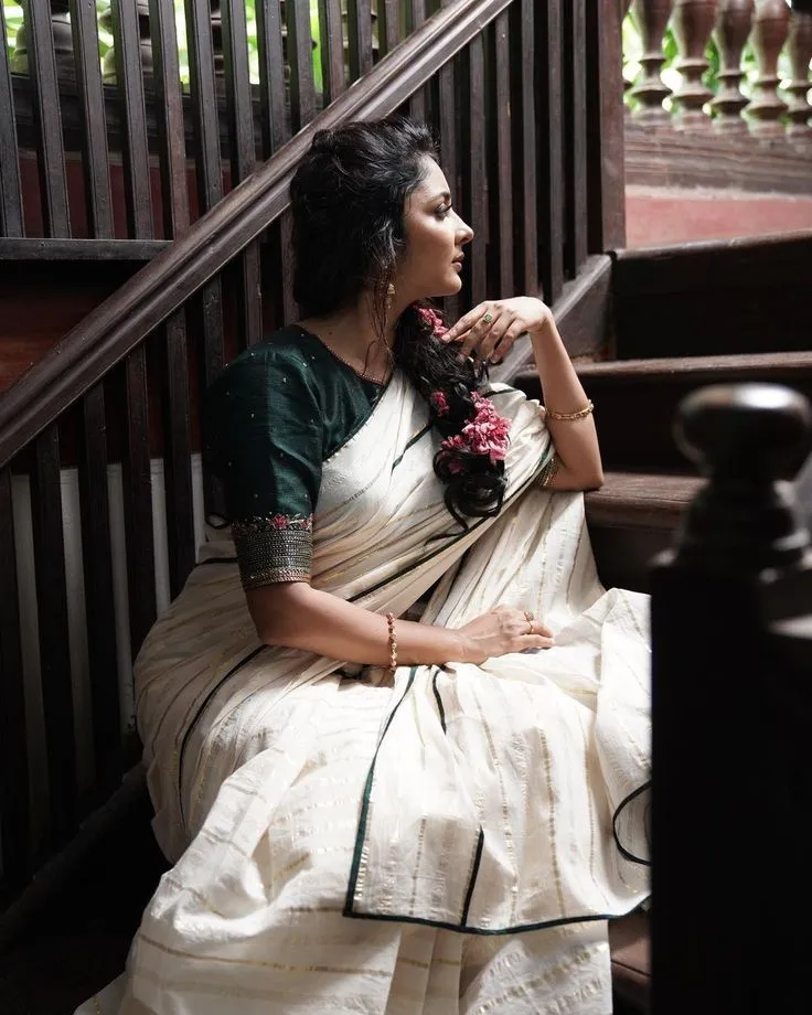Woman sitting in the strains and looking intensely wallpaper