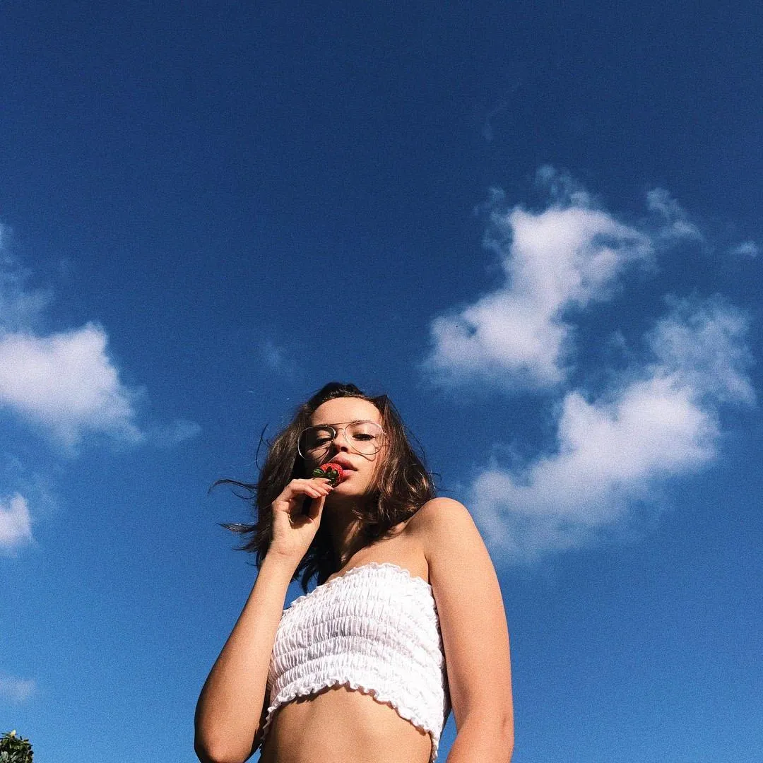 Woman Sitting on Motorcycle with Texas Flag Design Wallpaper
