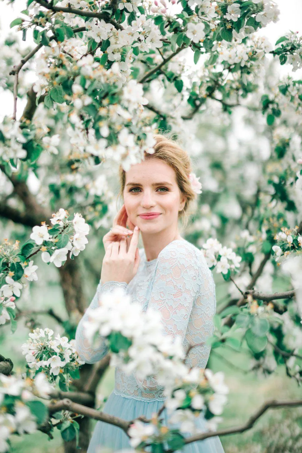 Woman in a Soft Light Resting Chin on Her Hand Thoughtfully