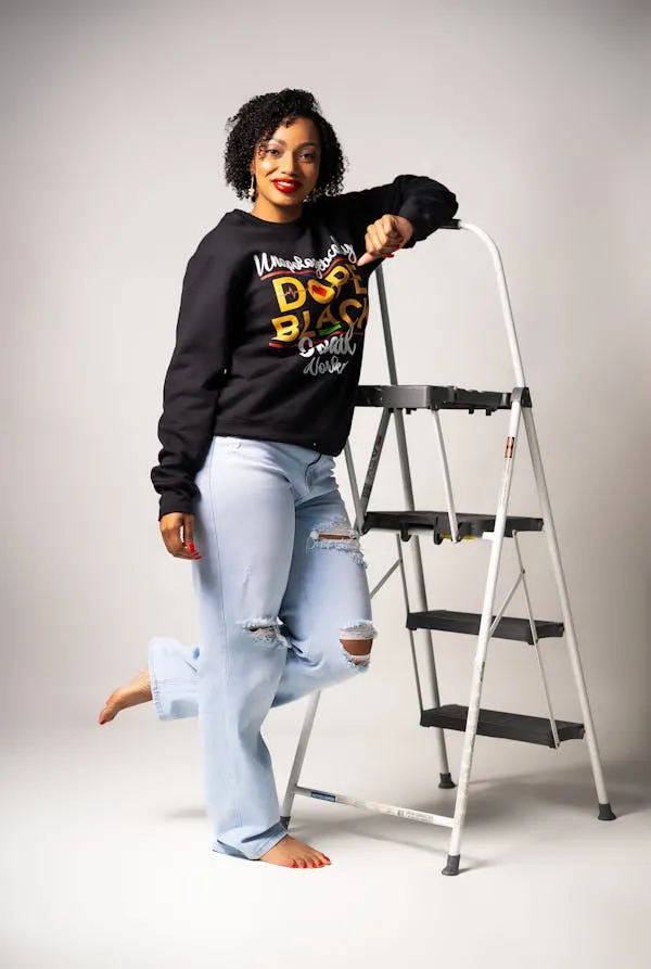Woman Standing Beside a Ladder in Casual Streetwear Hd Image