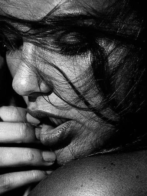 Woman Surrounded by Blooming Pink Flowers in a Spring Image