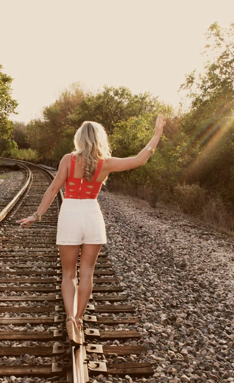 Woman Walking Along Railroad Tracks At Sunset Free Wallpaper