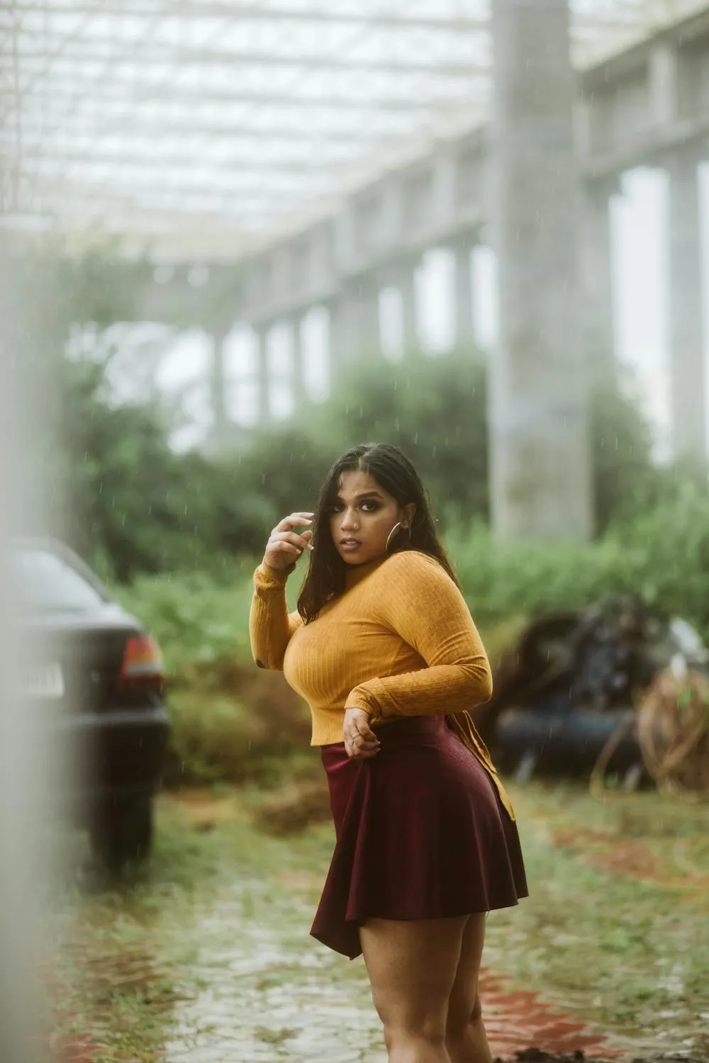 Woman Walking in Rustic Indoor Garden with a Casual Pose