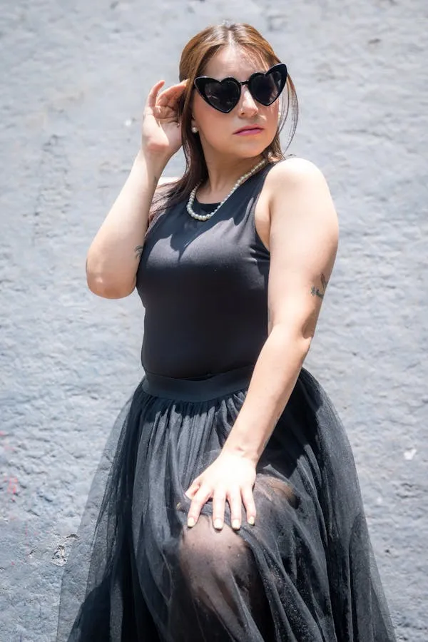 Woman Wearing Sunglasses and Black Sleeveless Top Wallpaper