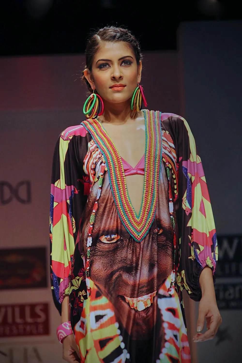 Woman Wearing Vibrant Colorful Patterned Dress on the Runway