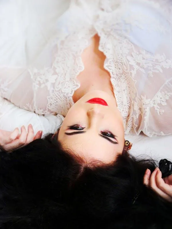 Woman in White Dress Lying Down with Red Lipstick Wallpaper