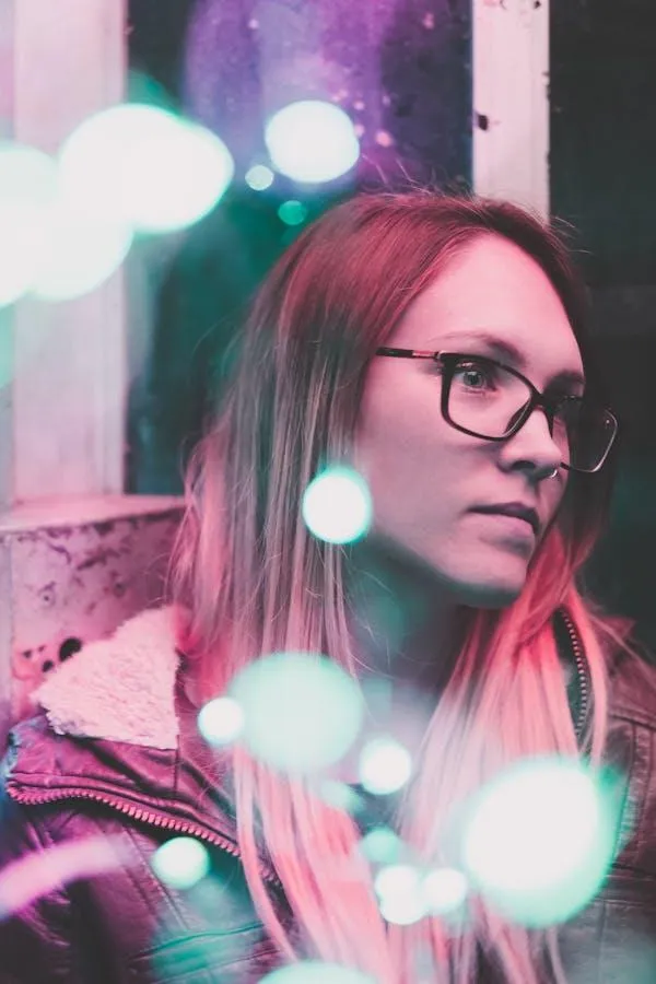 Young Woman with Glasses and Light by Dreamy Glowing Lights