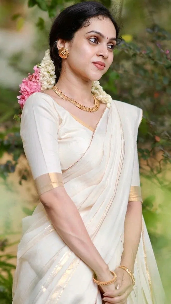 Young woman in a traditional dress with colourful flowers