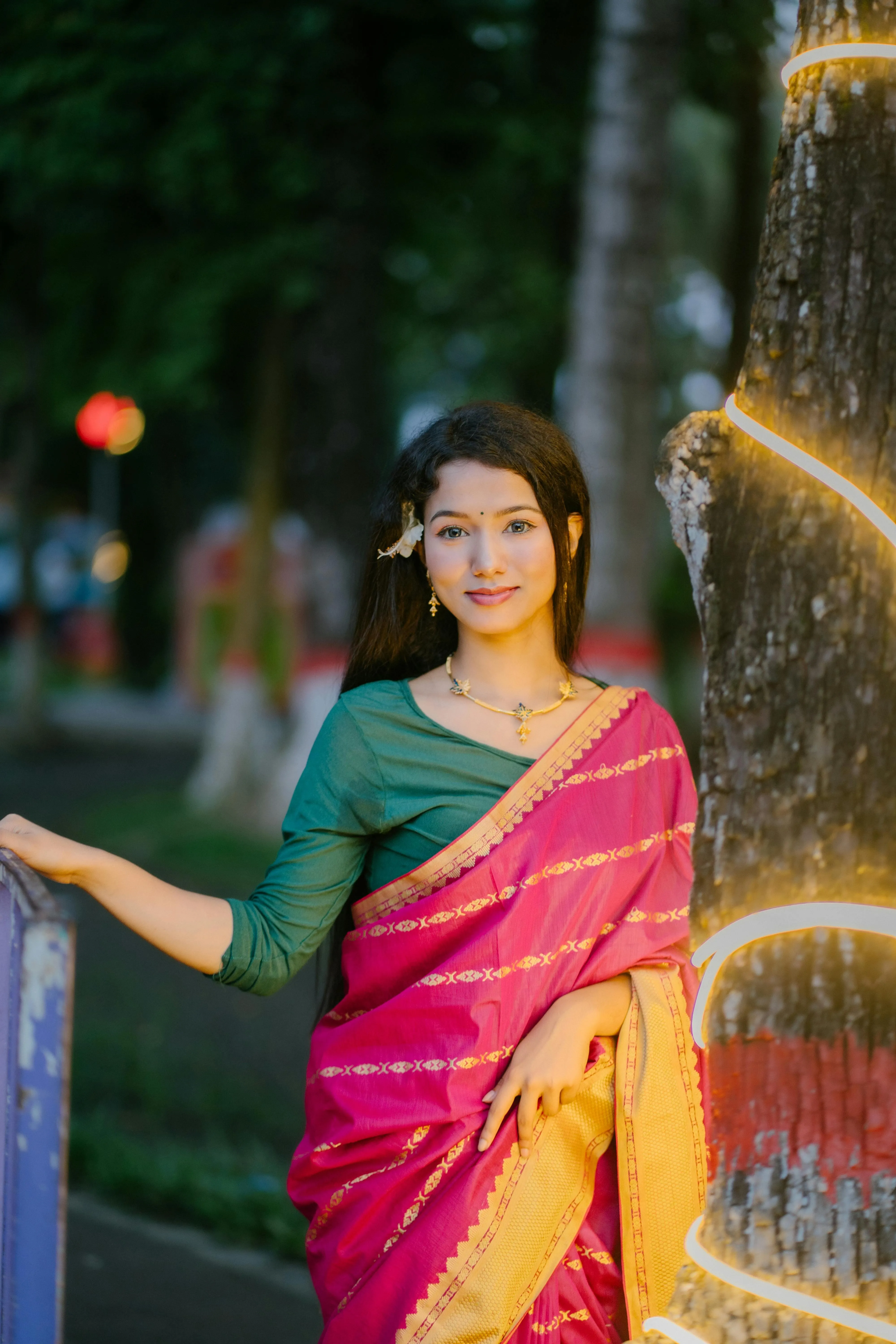 Young Woman in Pink Saree Standing with Natural Grace Image