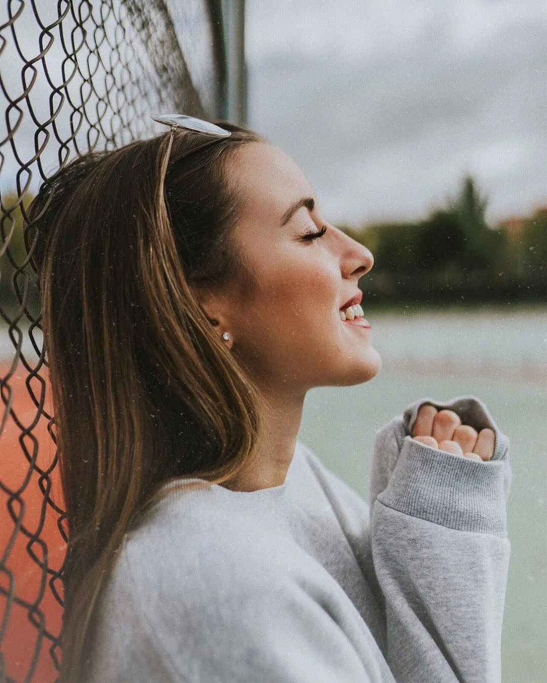 Young Woman Smiling and Enjoying the Outdoor Fresh Air Image