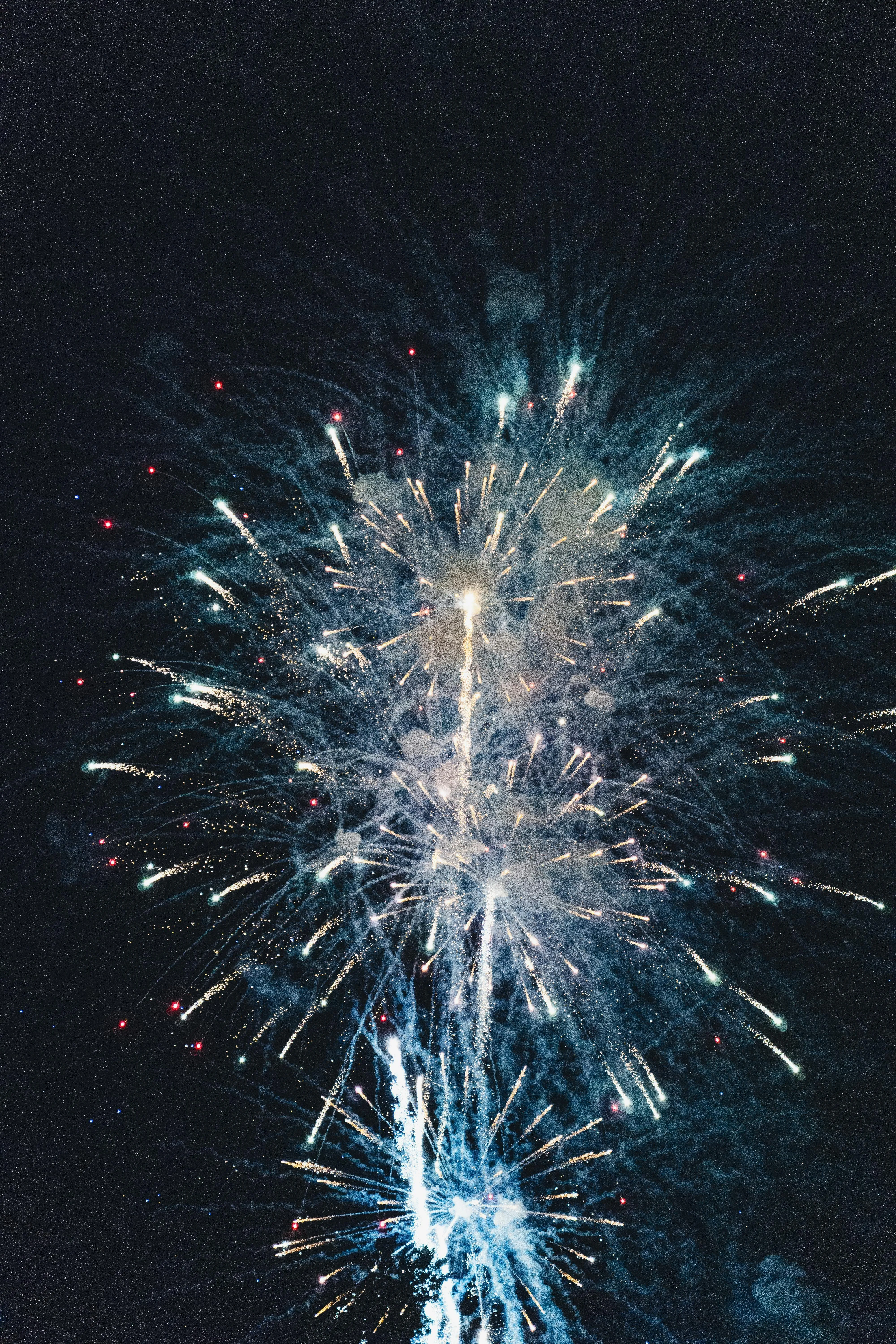 A Burst of Fireworks Lighting up the Night Sky Wallpaper