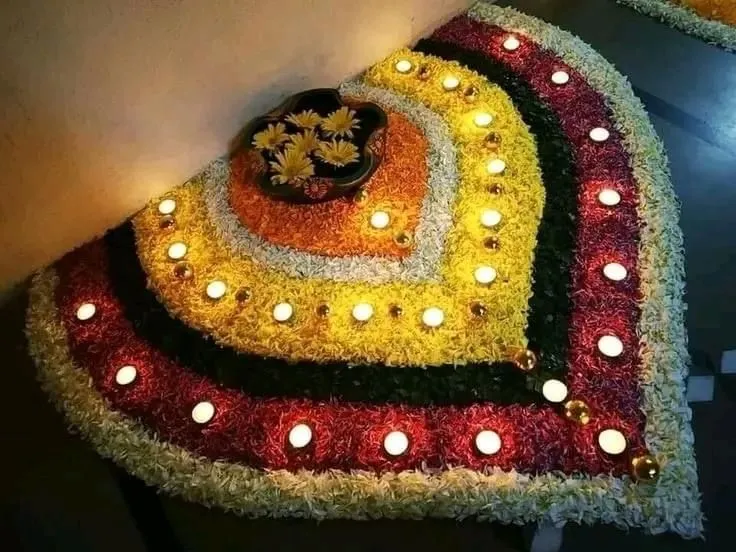 Abstract petal shape Athapookolam with lamp and flower bowl