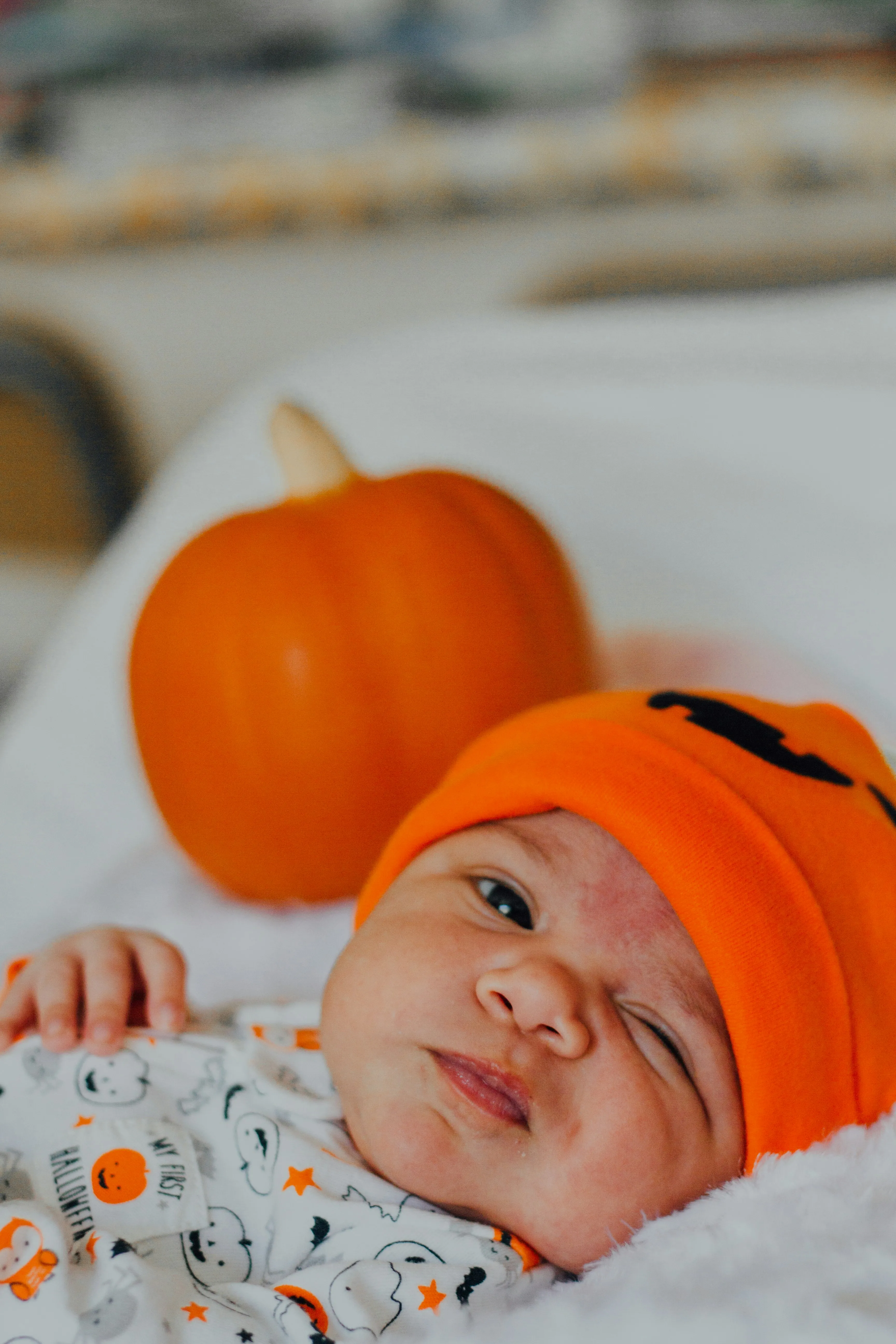 Adorable Baby with Hat and Pumpkin For Halloween Festival