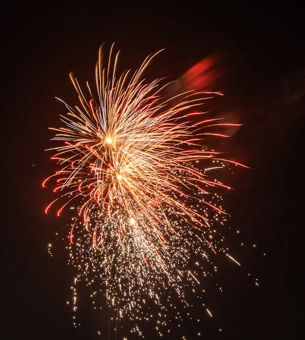 Amazing Bright Fireworks Burst with Red and Yellow Colors