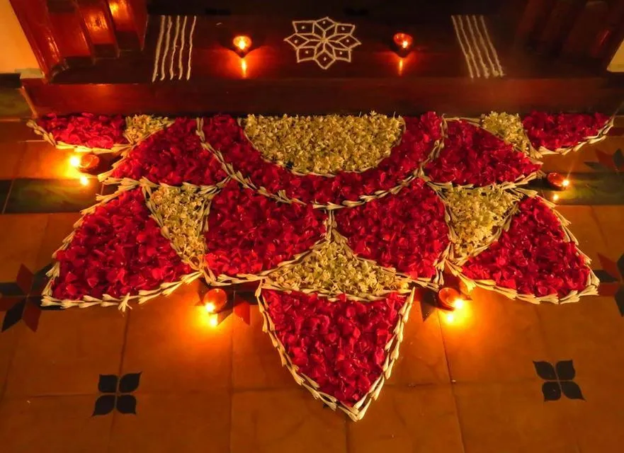 Amazing Half flower Athapookolam with glowing lamps image