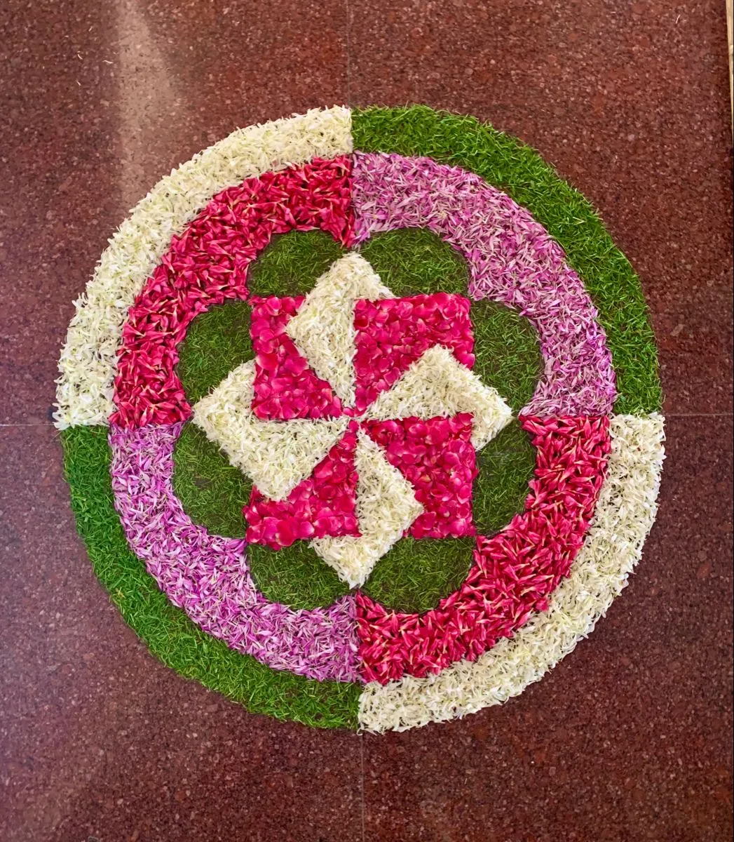 Amazing pookolam with a pinwheel circular design for Home