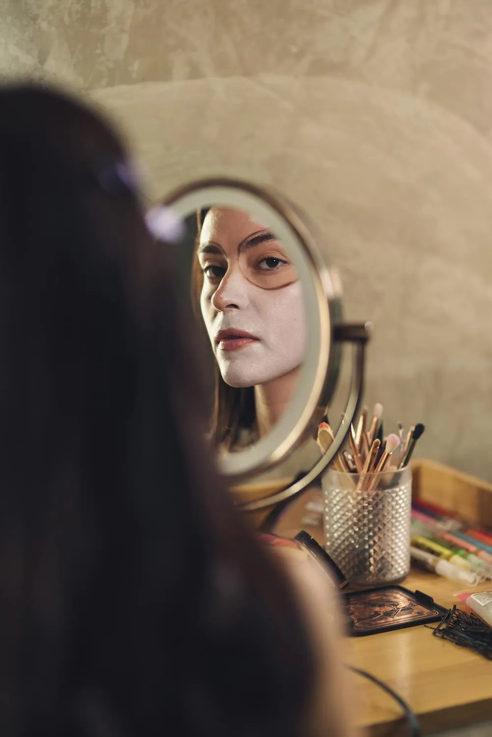 Artist Applies Skull Face Makeup with Precision Mirror View