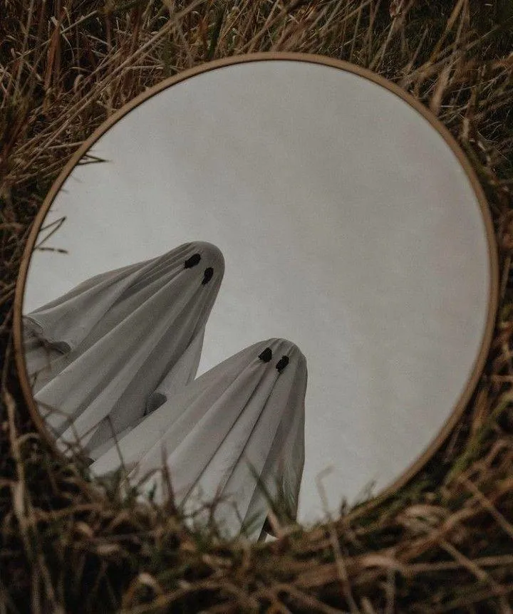 Artistic Reflection of Ghost Figures in Circular Mirror