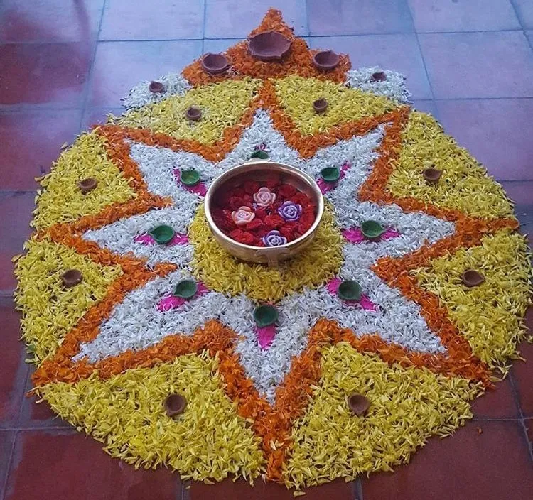 Athapookolam with bright petals and a Floating Flower Bowl