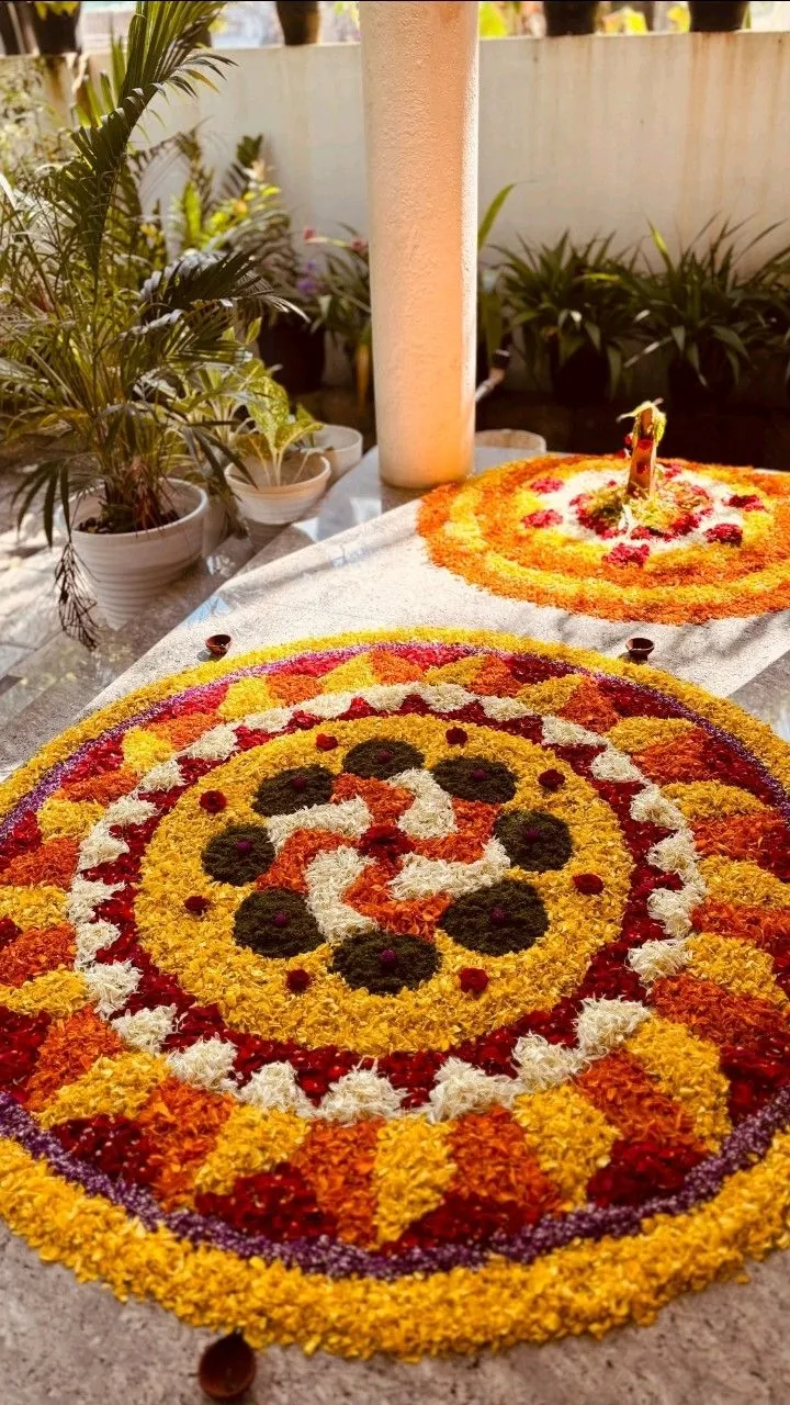 AthaPoolkolam in swastika design in the rangoli design