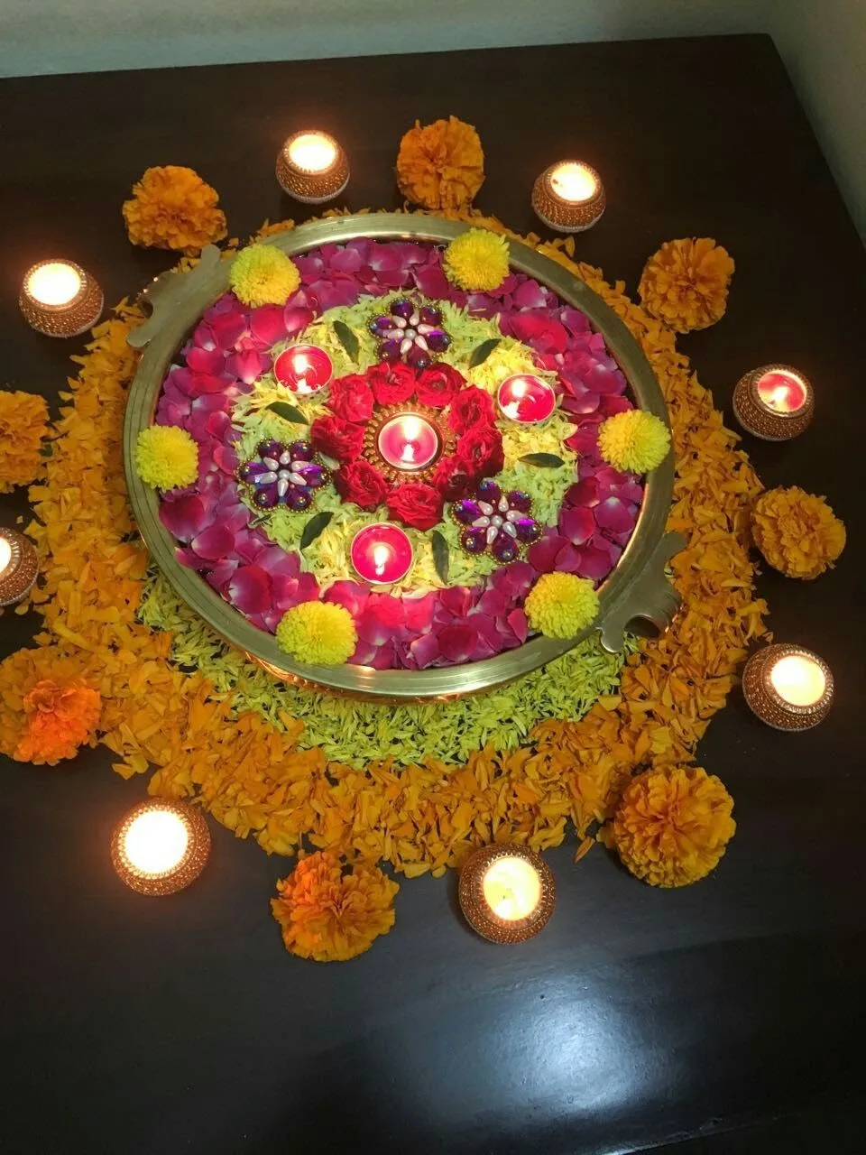 Athpookoolam with a vessel of flowers centerpiece wallpaper