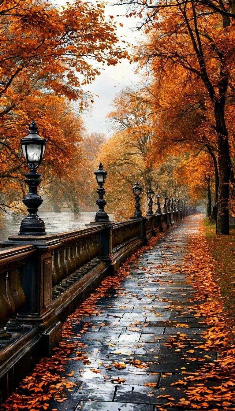 Autumn Park Pathway Lined with Lamps and Falling Leaves