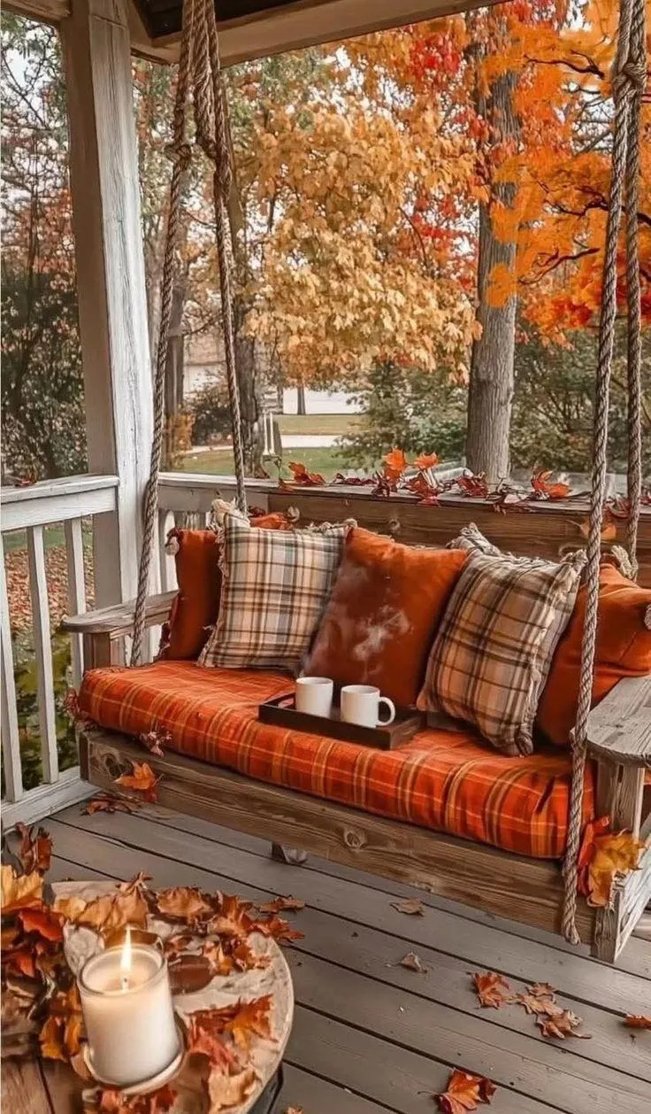 Autumn Porch Swing with Cushions and Pumpkin Decoration