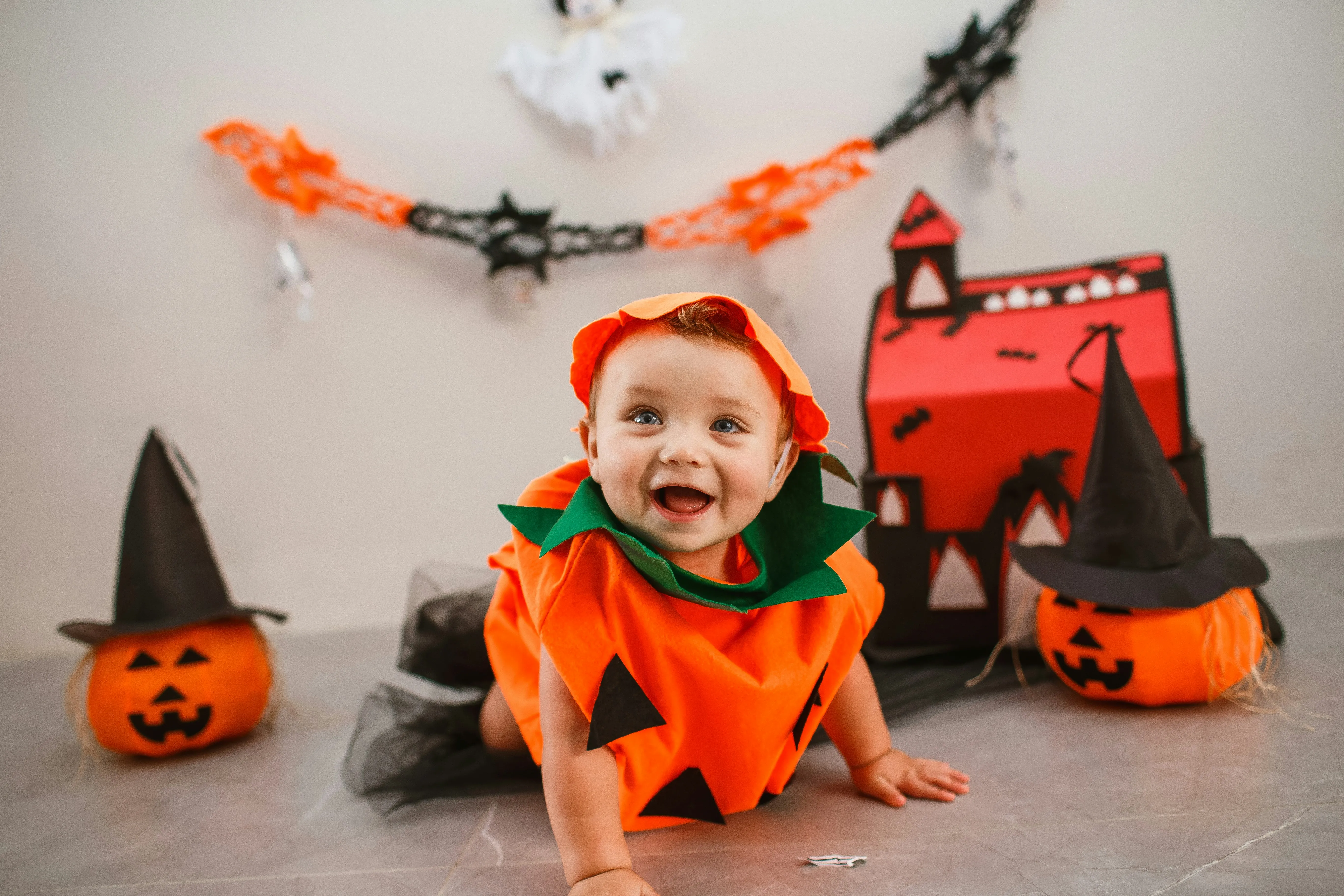 Baby in Halloween Costume with Pumpkins and Decortion HD