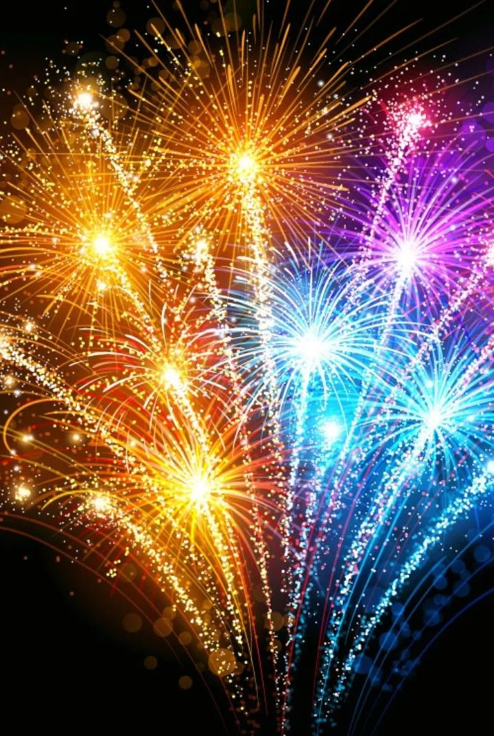 Beautiful fireworks in blue gold and red in the dark sky