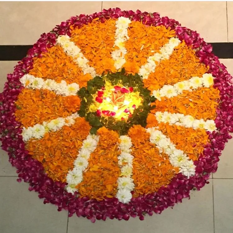 Beautiful flower pookolam with a glowing light center image