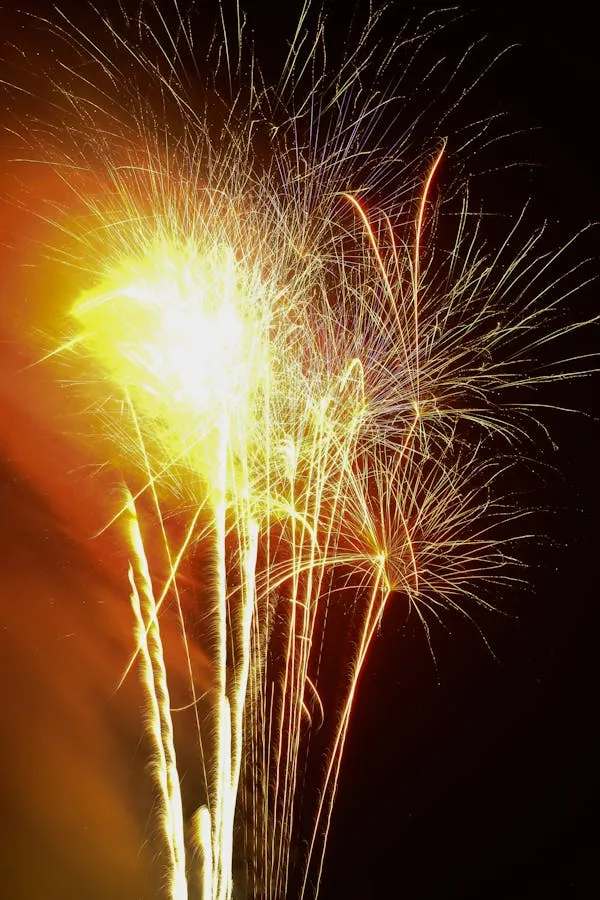 Beautiful golden fireworks against a dark background HD