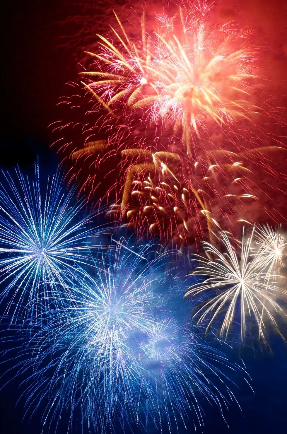 Beautiful Mix of Blue and Red Fireworks over Water