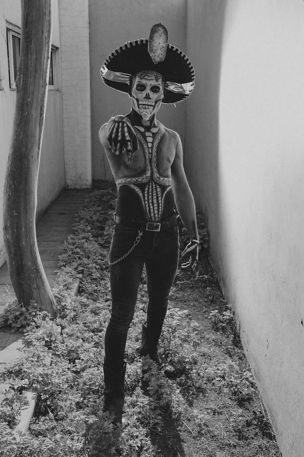 Black and White Image of Person in Skeleton and Pumpkin Costume