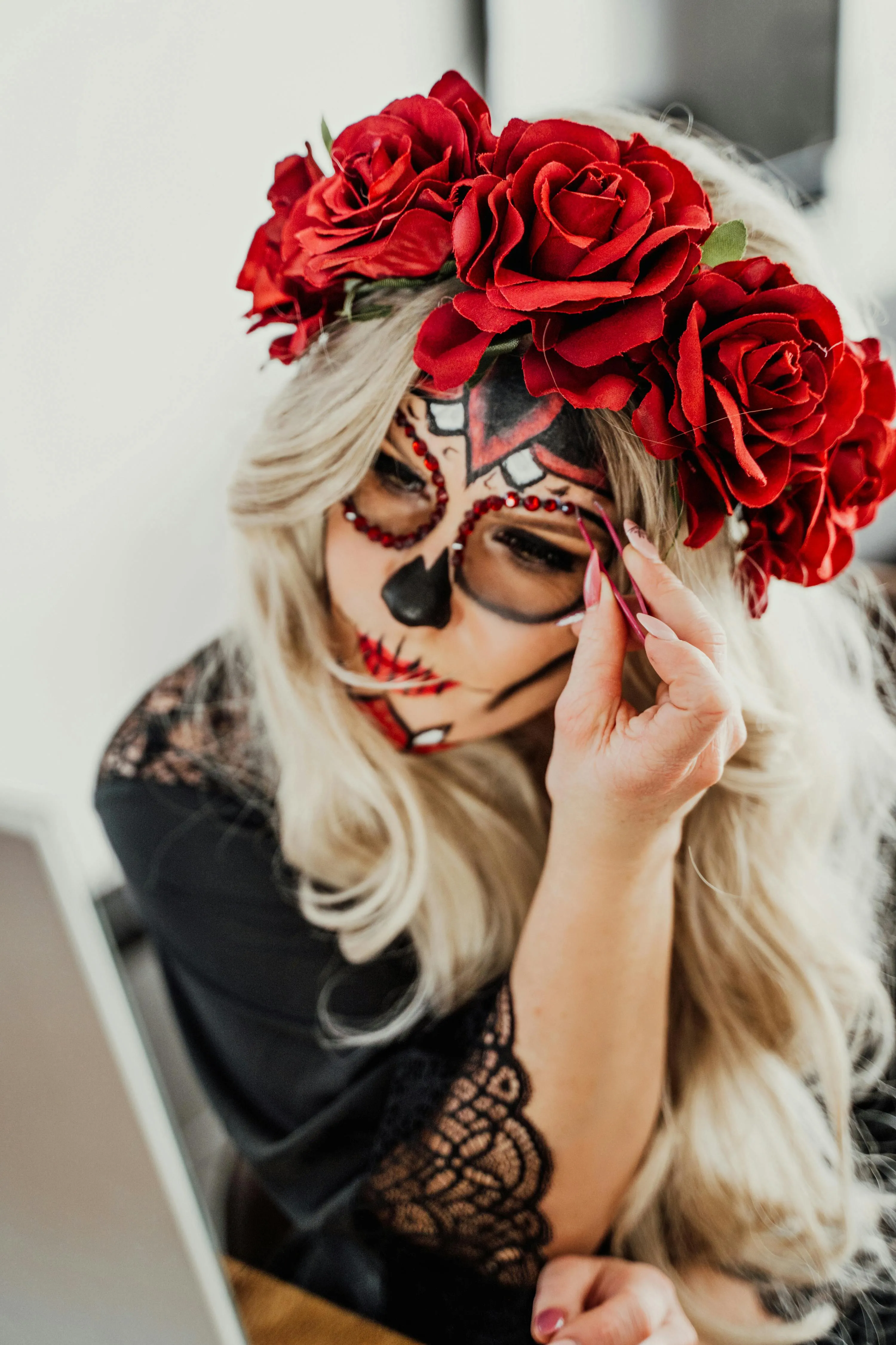 Blonde Woman with Rose Headpiece and Sugar Skull Makeup