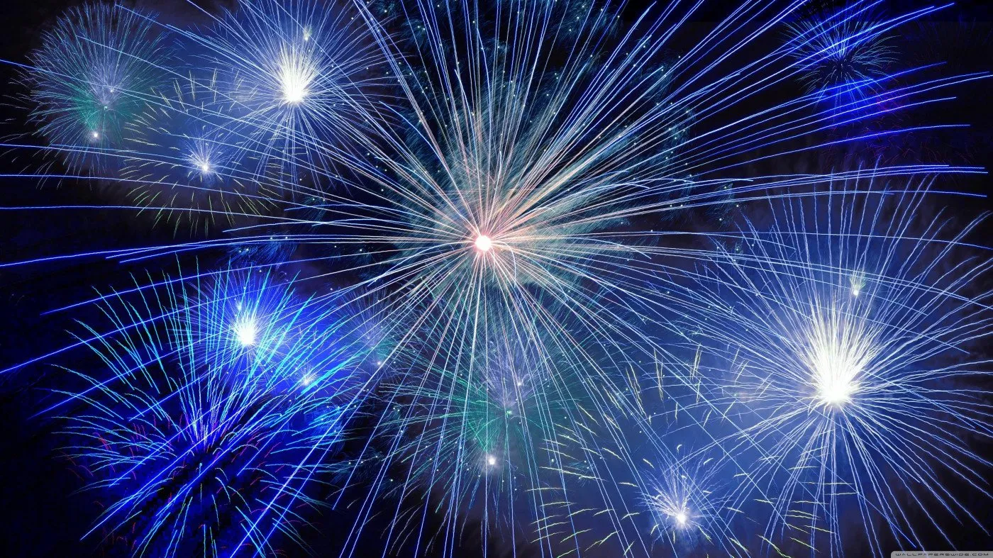 Blue Fireworks Lighting up The Night Sky free Wallpaper