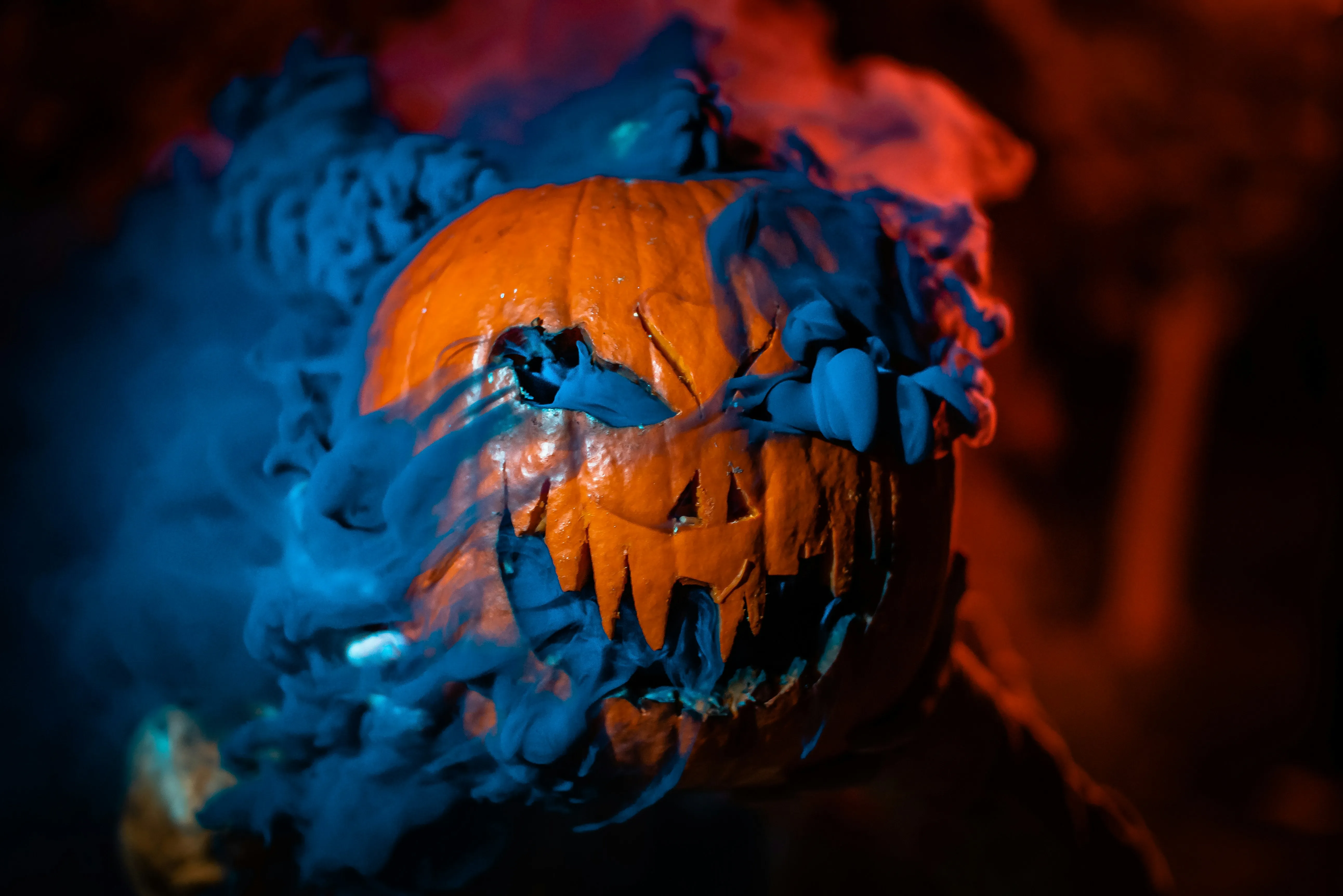 Blue Glowing Evil Pumpkin For Halloween Horror Wallpaper