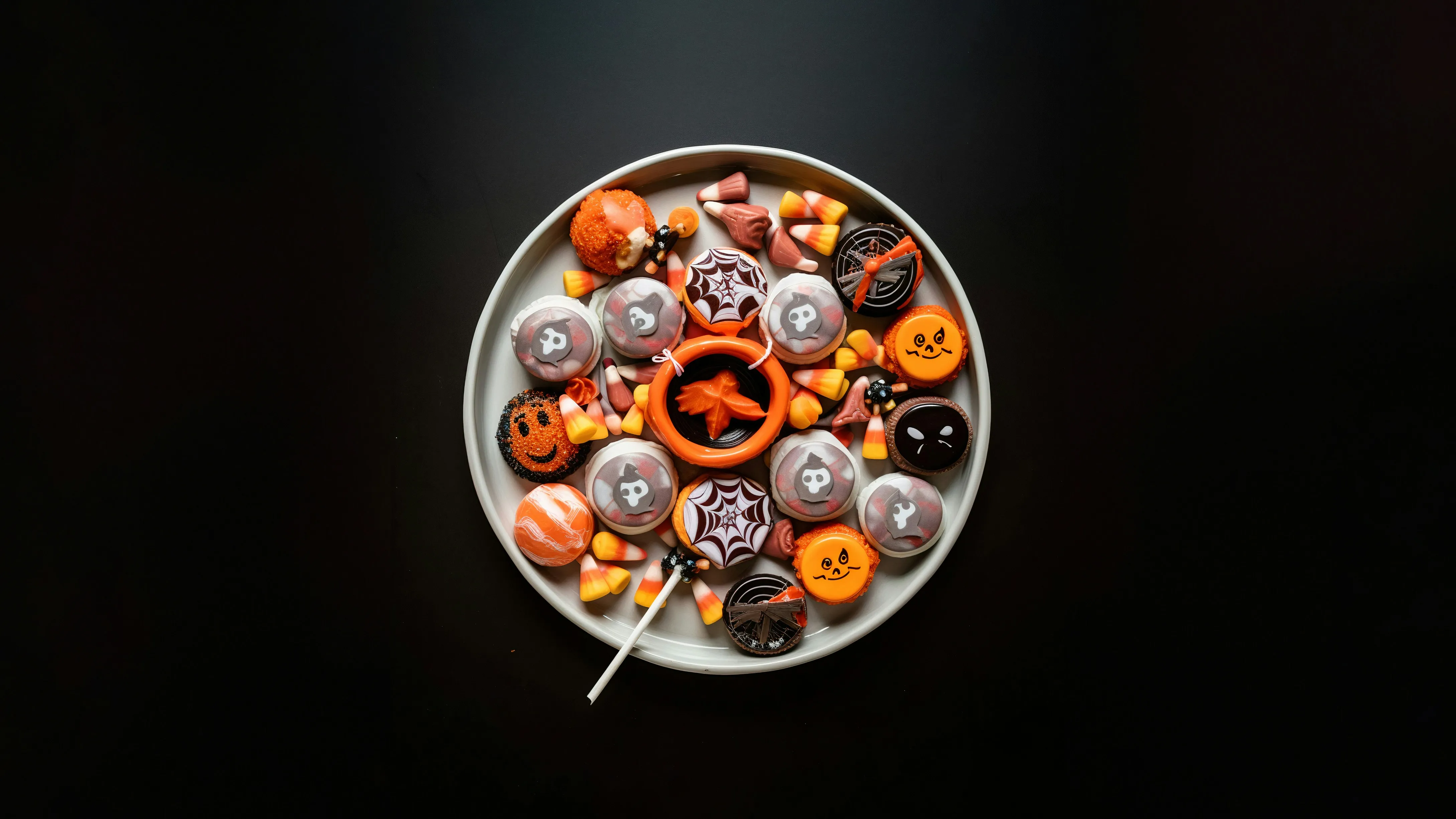 Bowl Of Halloween Candy with Pumpkin-Shaped Treats Image