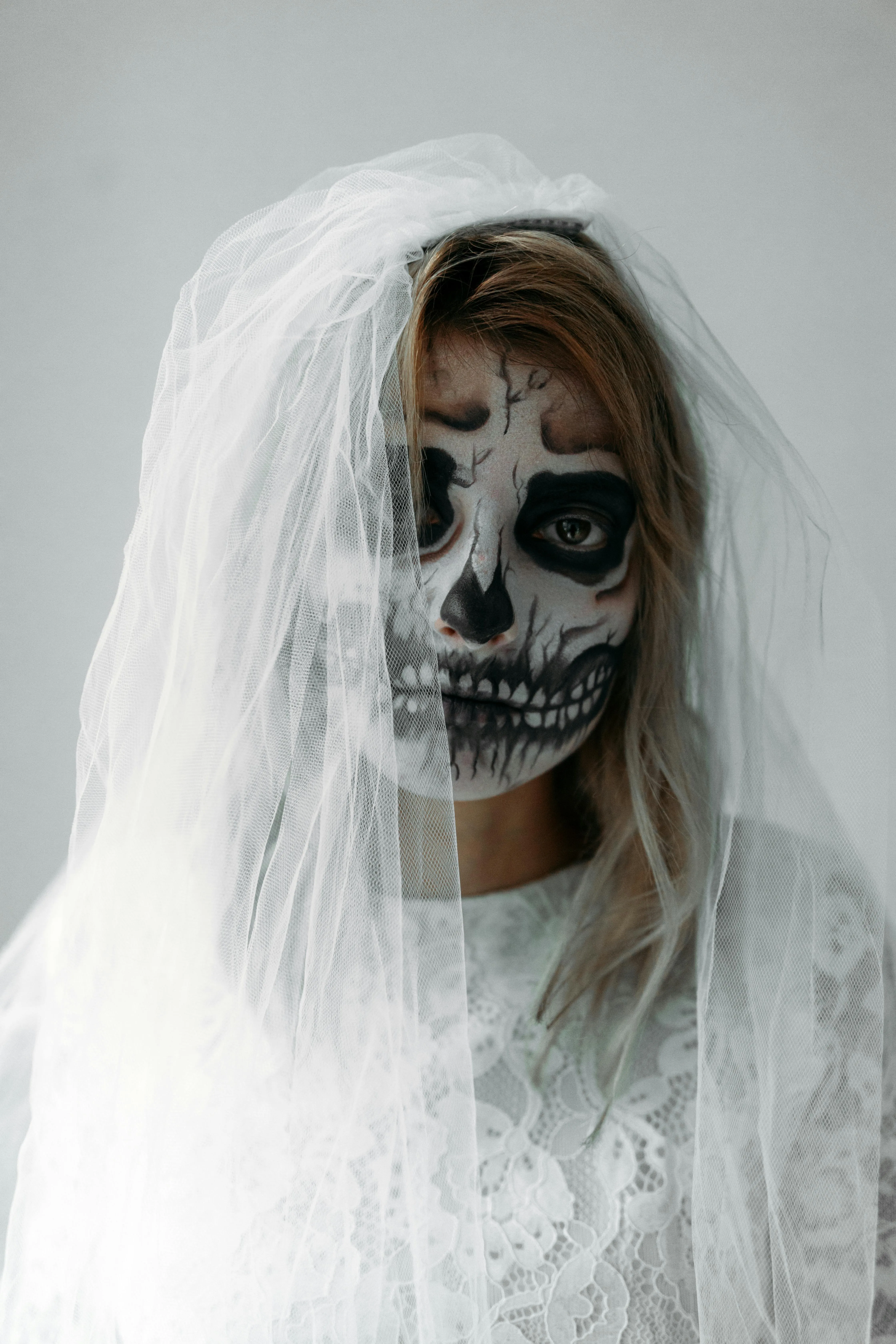 Bride with Skull Face Paint Wearing White Veil Wallpaper