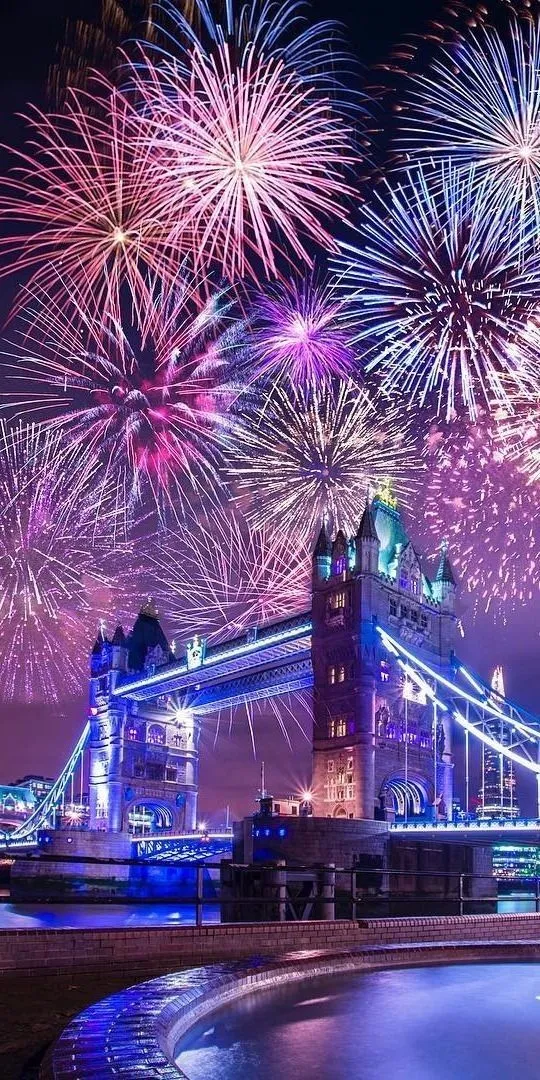 Bright and colorful fireworks over the iconic Brooklyn Bridge