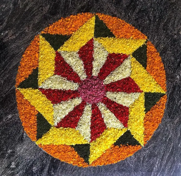 Bright and colourful Onam pookalam in a Circular Pattern