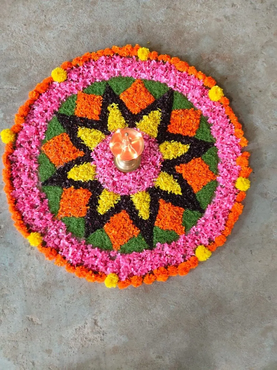 Bright Athapookolam with glowing traditional lamp wallpaper