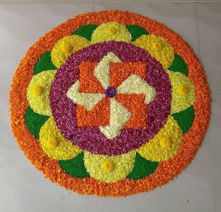 Bright circular pookolam with pinwheel center Design image