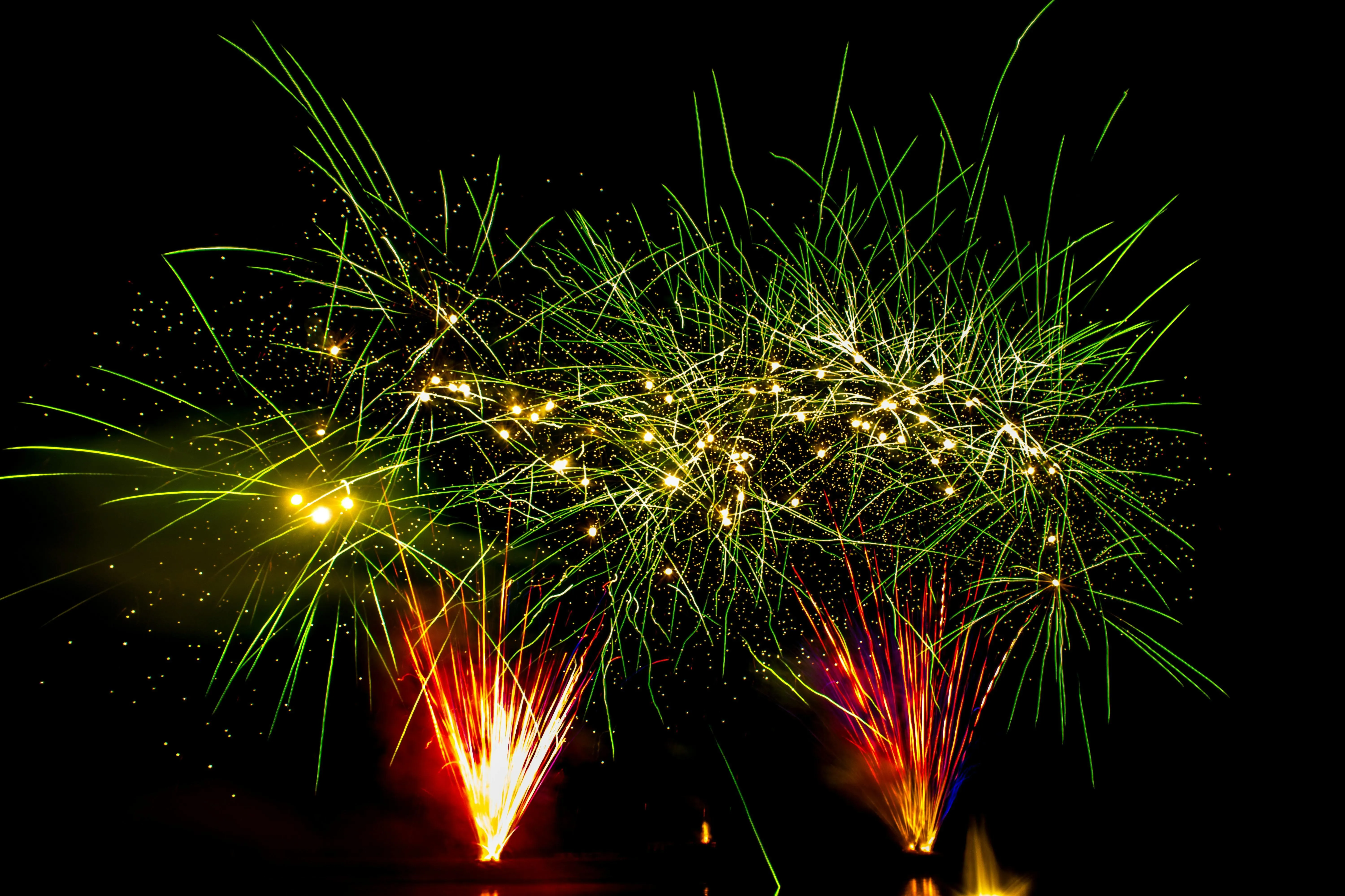 Bright Fireworks Bursting over Dark Night Sky HD image